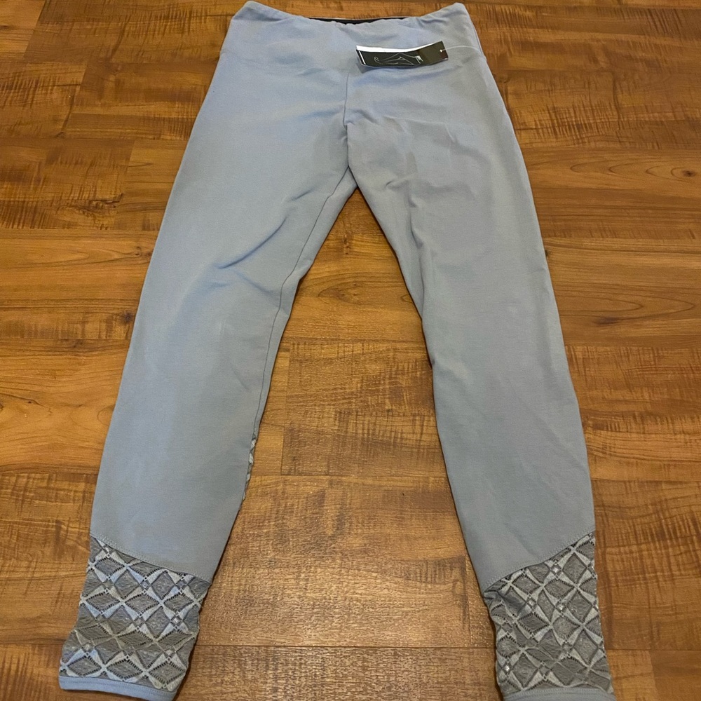 Adorable work out pants. Comfortable! Lace bottom cuffs. New with tags.